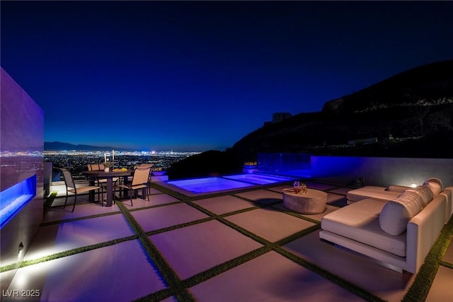 patio at twilight with a mountain view