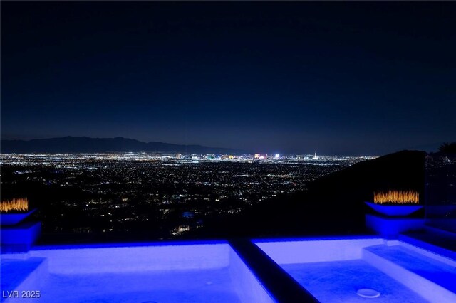 view of pool at night