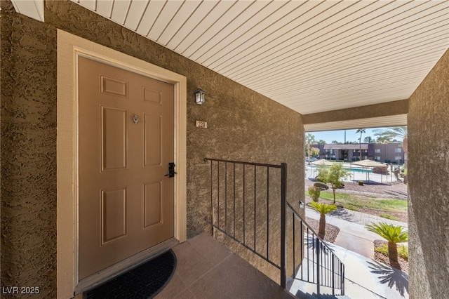 property entrance featuring covered porch