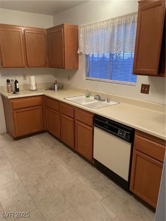 kitchen with white dishwasher and sink