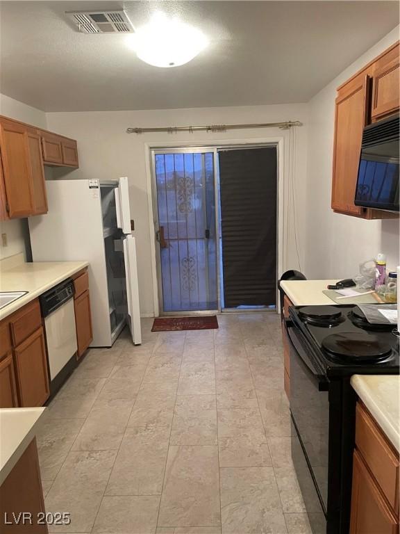 kitchen with black appliances and sink