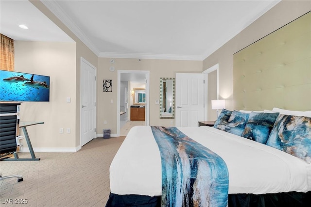 carpeted bedroom featuring ensuite bath and ornamental molding