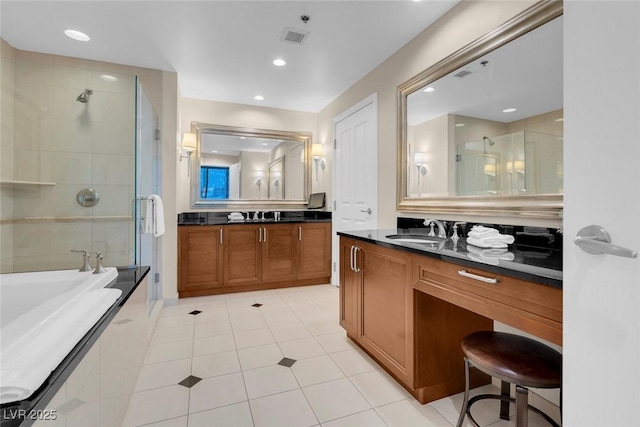 bathroom featuring tile patterned floors, vanity, and plus walk in shower