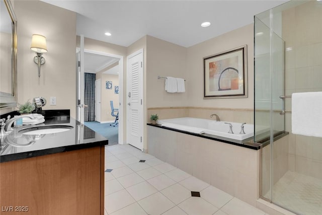 bathroom featuring vanity, tile patterned floors, and separate shower and tub