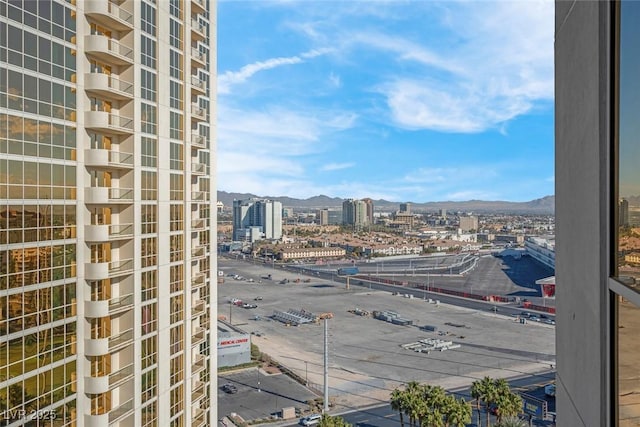 property's view of city with a mountain view