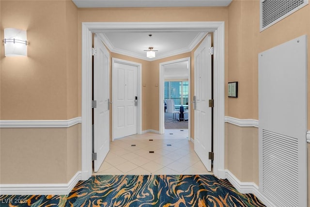 interior space with light tile patterned flooring and crown molding