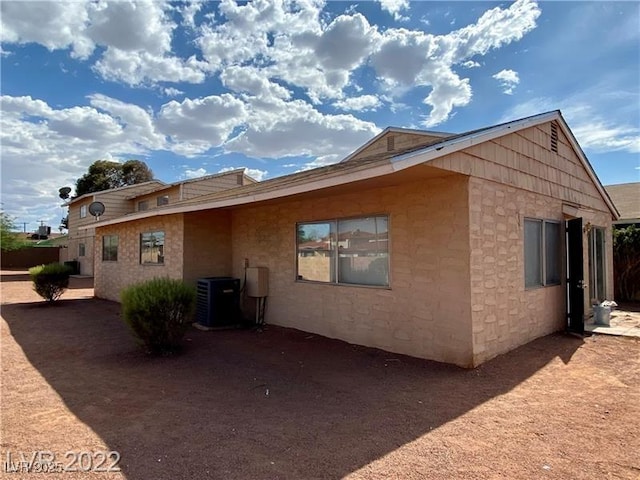 back of property with central air condition unit