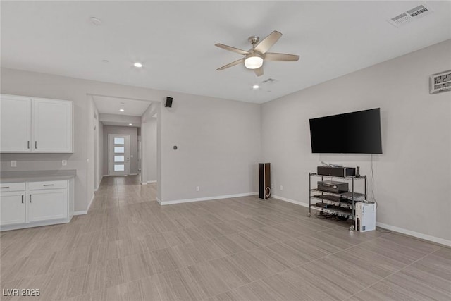 unfurnished living room featuring ceiling fan