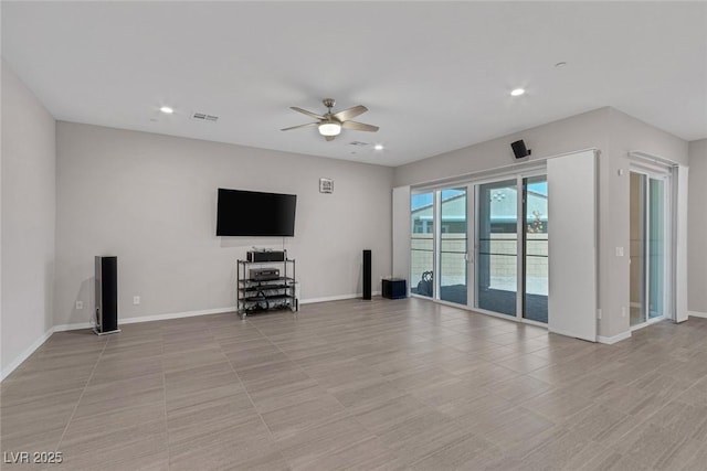 unfurnished living room with ceiling fan