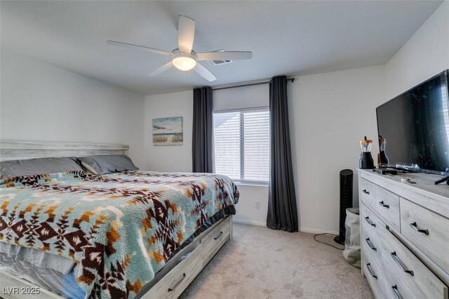 bedroom featuring ceiling fan and light carpet