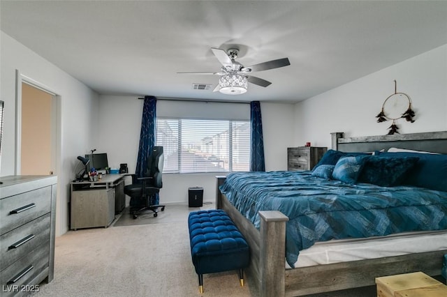 bedroom featuring light colored carpet and ceiling fan