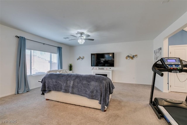 bedroom featuring light carpet and ceiling fan