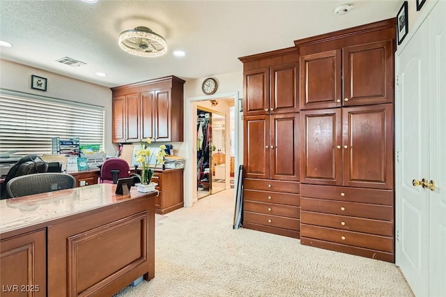 home office with light colored carpet