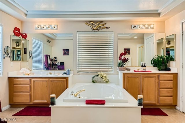 bathroom featuring vanity, a washtub, and tile patterned flooring