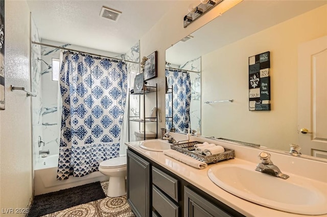 full bathroom featuring shower / tub combo with curtain, vanity, tile patterned floors, and toilet