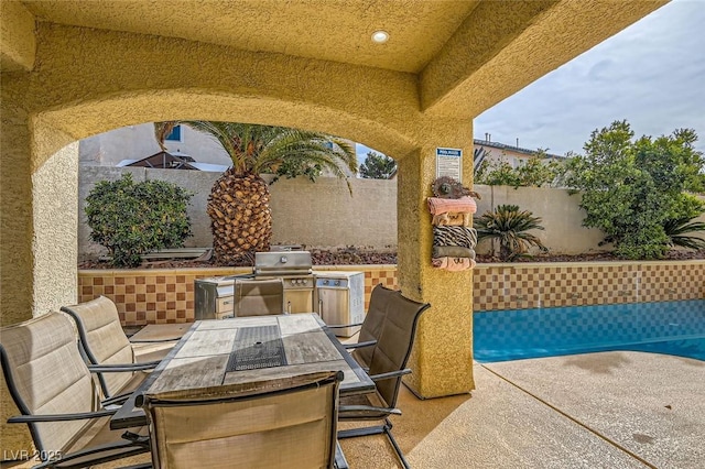 view of patio / terrace with area for grilling and exterior kitchen