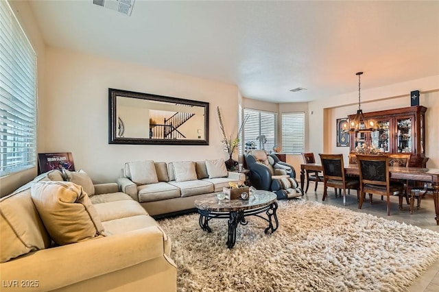 living room with an inviting chandelier