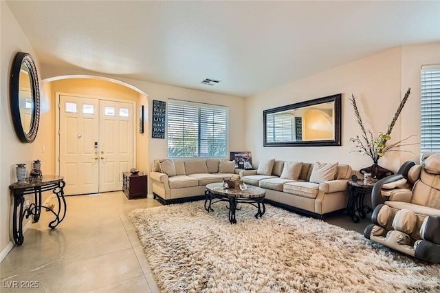 living room with light tile patterned flooring