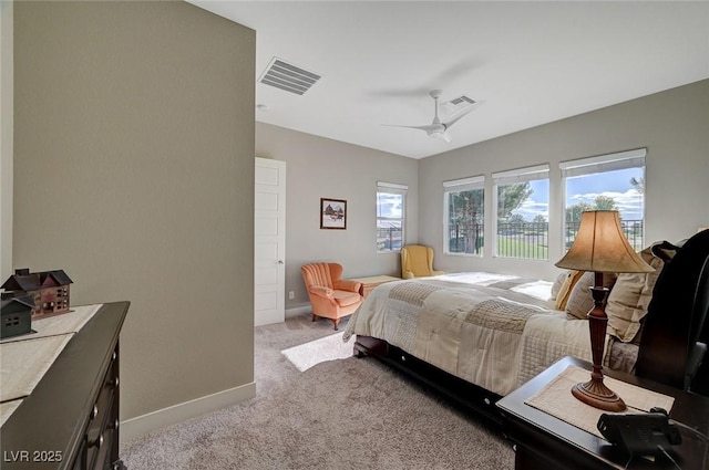 bedroom featuring ceiling fan and light colored carpet