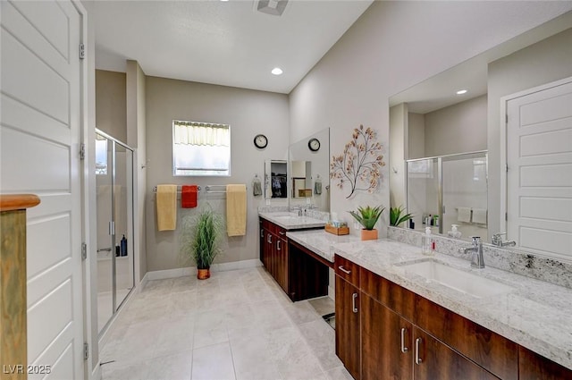 bathroom featuring vanity, tile patterned floors, and an enclosed shower