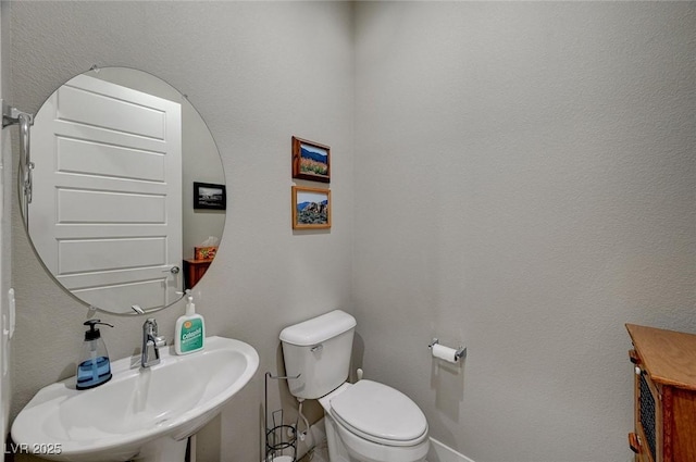 bathroom with sink and toilet