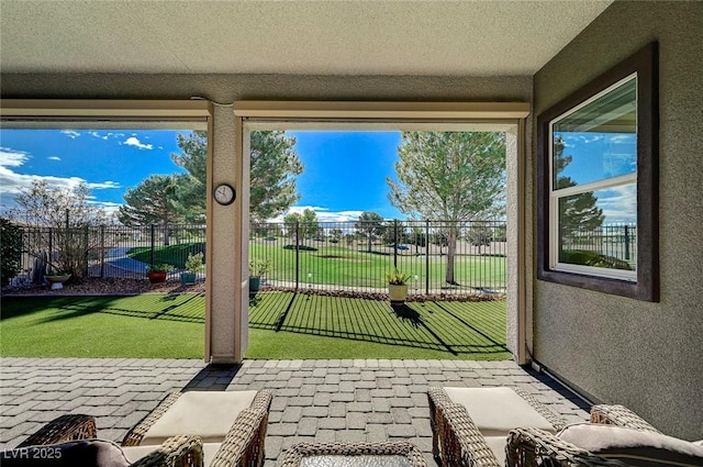 entryway featuring a textured ceiling and golf simulator