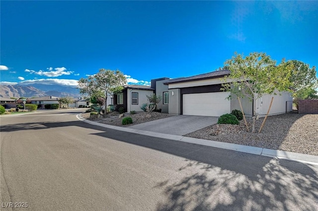 view of front of house featuring a mountain view and a garage