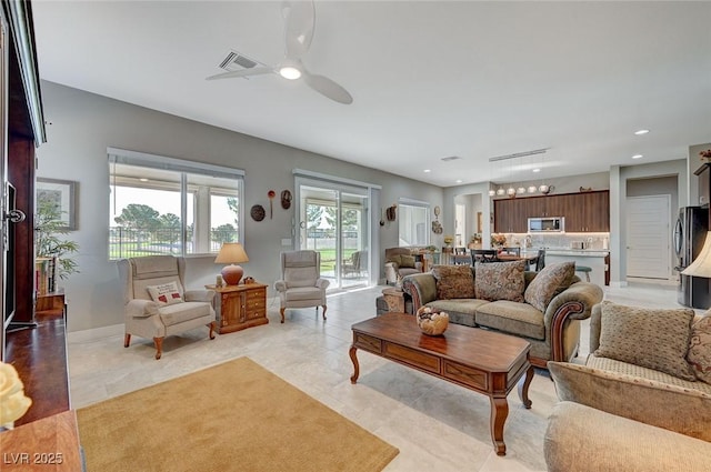 living room with ceiling fan