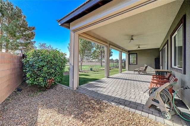 view of patio with ceiling fan