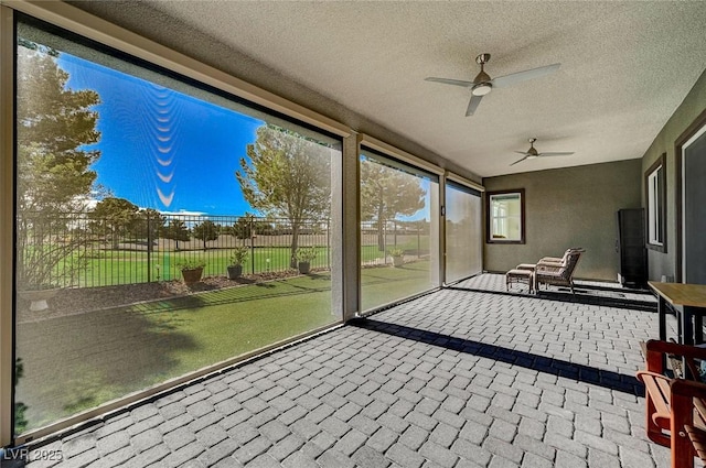 sunroom with ceiling fan