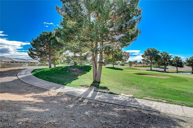 view of property's community featuring a yard