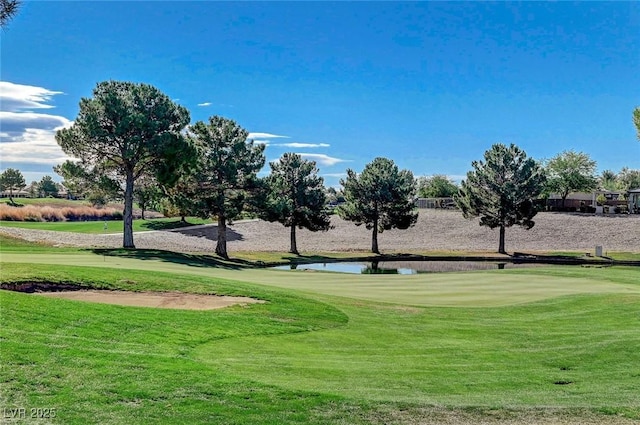 view of home's community with a yard and a water view