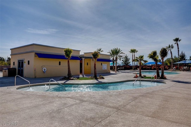 view of swimming pool featuring a patio area