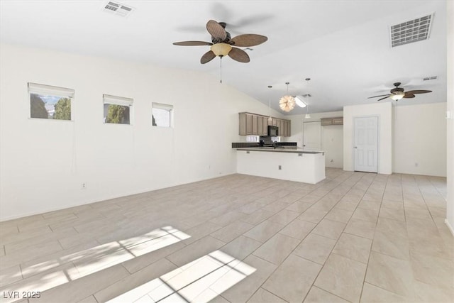 unfurnished living room with ceiling fan and lofted ceiling