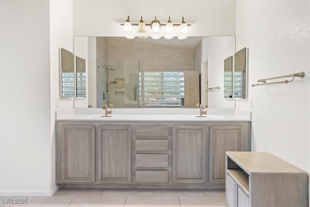 bathroom with tile patterned flooring, vanity, and a shower with shower door