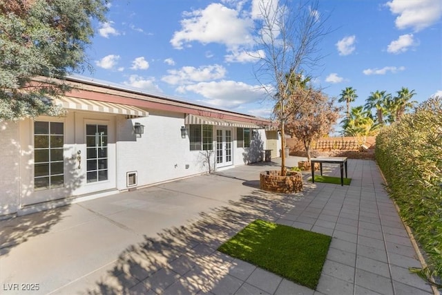 back of house featuring a patio area and french doors