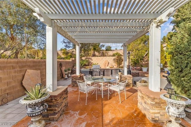 view of patio featuring a pergola and exterior kitchen