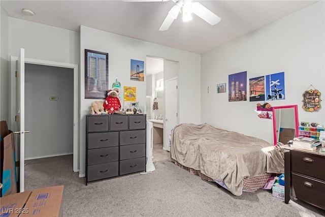 bedroom featuring connected bathroom, ceiling fan, and light colored carpet