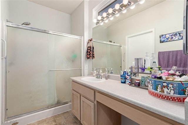 bathroom with vanity and an enclosed shower