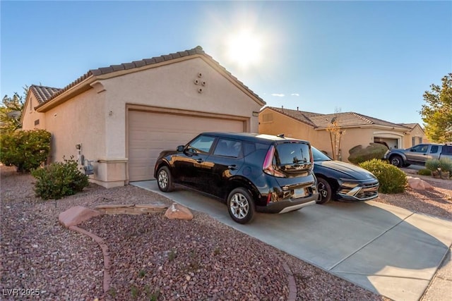 view of side of home with a garage