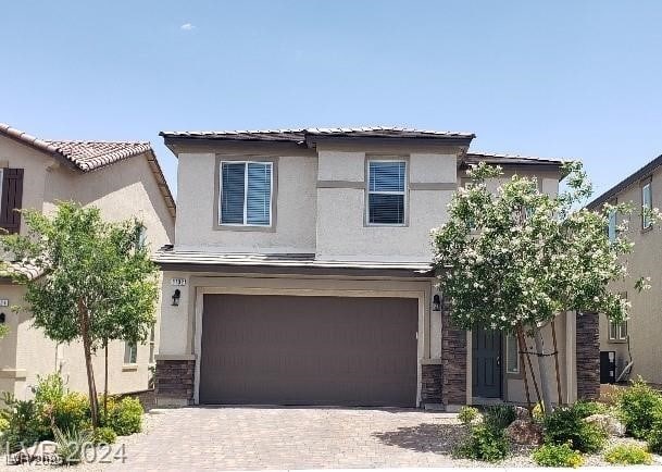 view of front of property with a garage