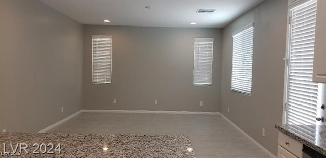 empty room featuring light tile patterned floors