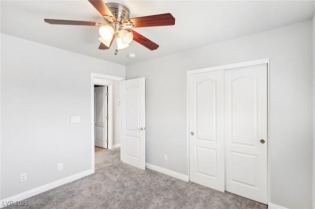 unfurnished bedroom featuring ceiling fan, a closet, and light carpet