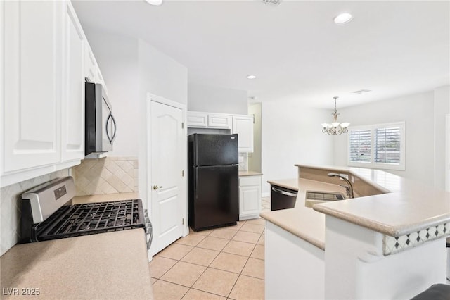 kitchen with white cabinetry, hanging light fixtures, stainless steel appliances, tasteful backsplash, and light tile patterned floors