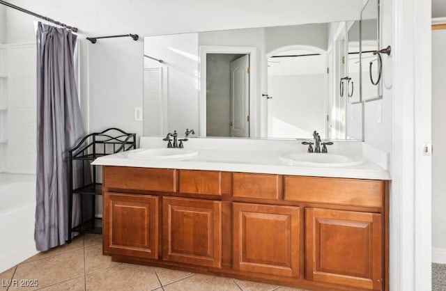 bathroom featuring tile patterned floors, shower / bath combination with curtain, and vanity