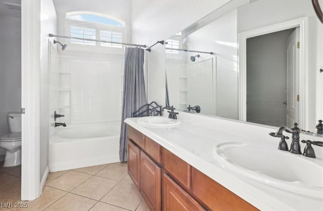 full bathroom featuring toilet, shower / tub combo, vanity, and tile patterned floors