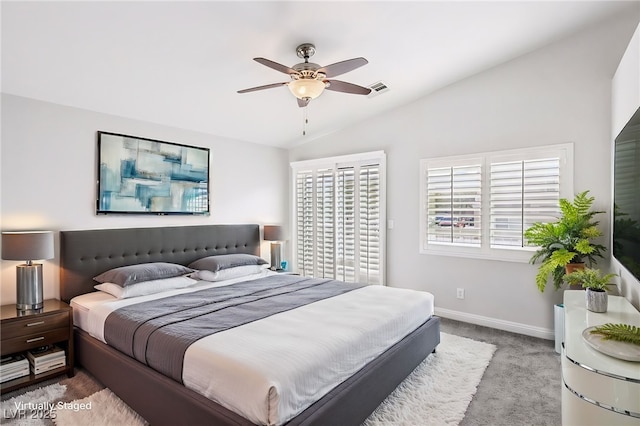 bedroom featuring carpet floors, vaulted ceiling, and ceiling fan