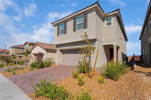 mediterranean / spanish-style house featuring a garage