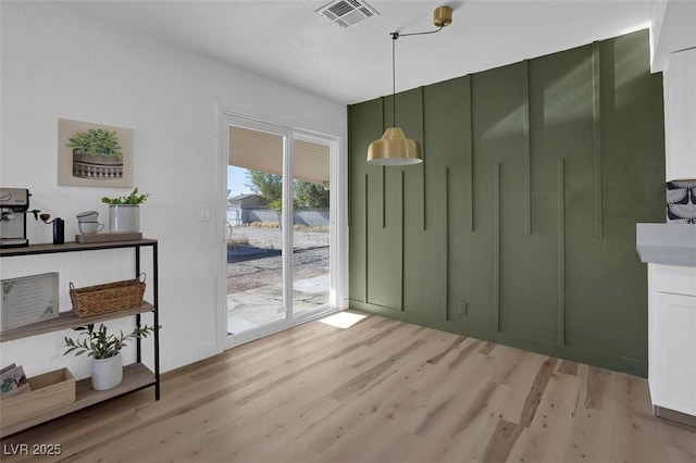 dining space featuring light hardwood / wood-style flooring