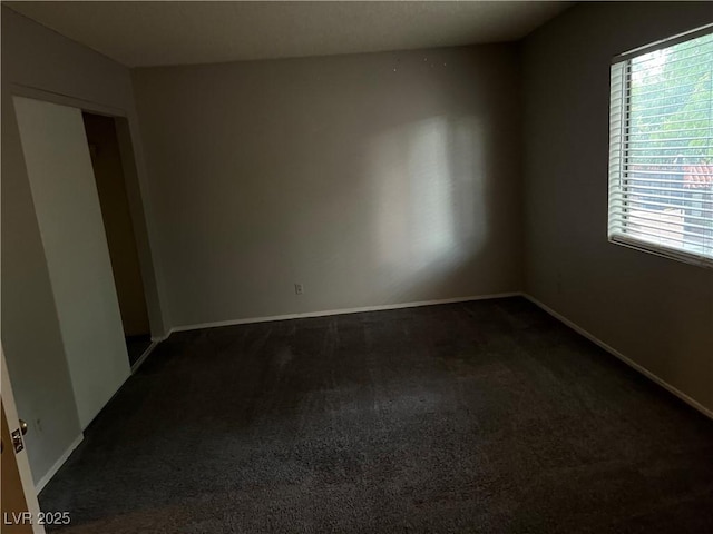 carpeted empty room featuring a healthy amount of sunlight